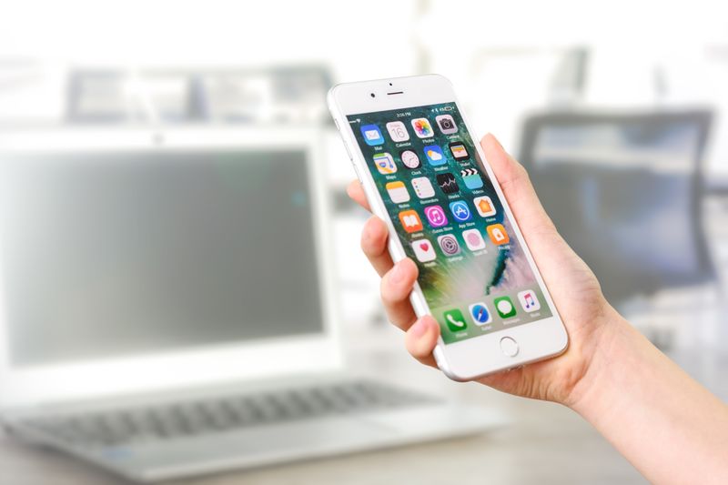 Close-up view of a smartphone displaying apps
